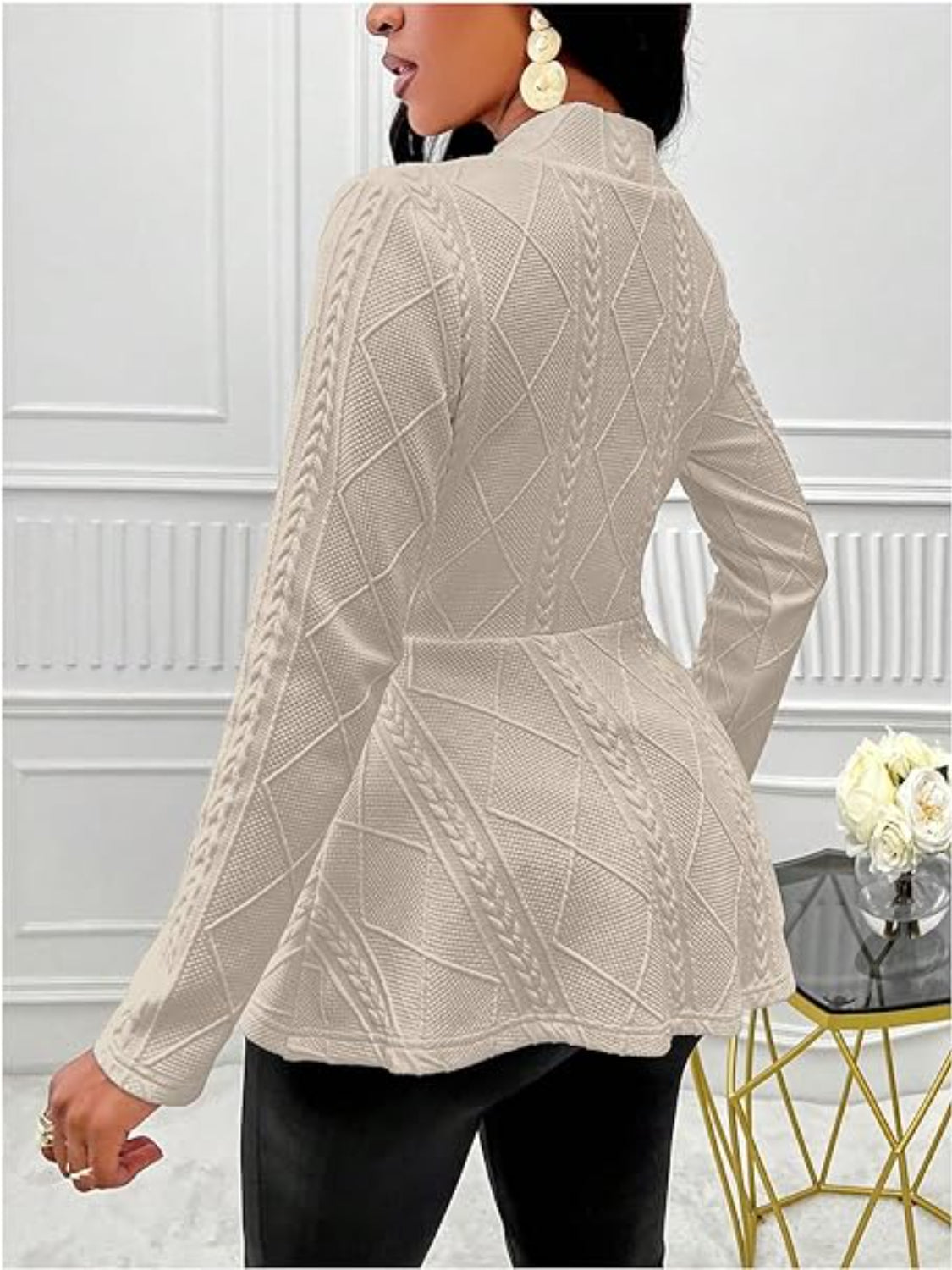 Tan textured knit peplum blazer with cable knit details and a diamond pattern.