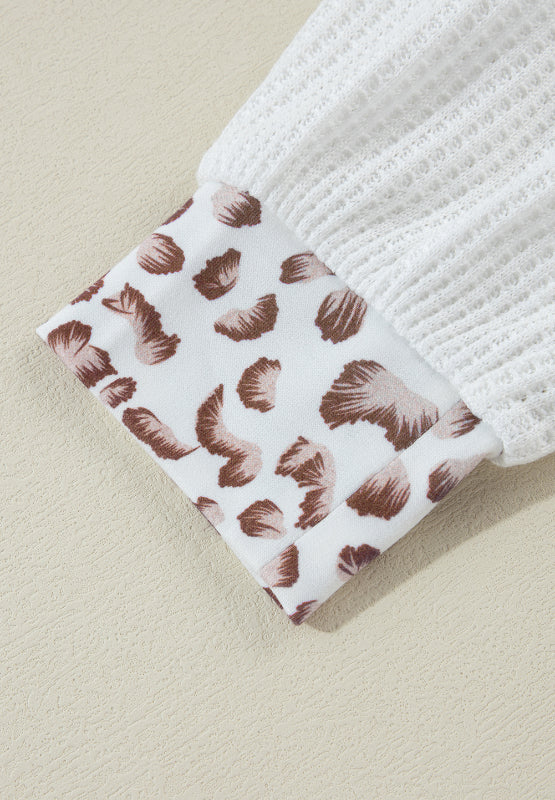 White waffle knit polo with leopard print cuff detail