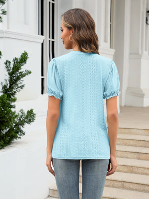 Light blue eyelet puff sleeve v-neck blouse with ruffled cuffs