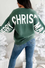 Green graphic long-sleeve sweater with white "MERRY CHRISTMAS" text on back and sleeves.