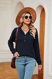Navy textured henley hoodie with drop shoulder and button placket.