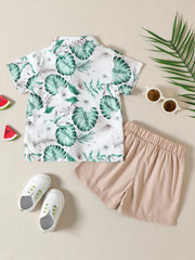 Baby tropical print shirt and beige shorts set, short sleeve button-up top.