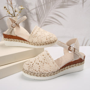 Ivory crochet espadrille sandals with ankle strap and jute platform sole.