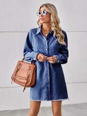 Dark blue denim shirt dress with raw hem, buttons, and pockets.