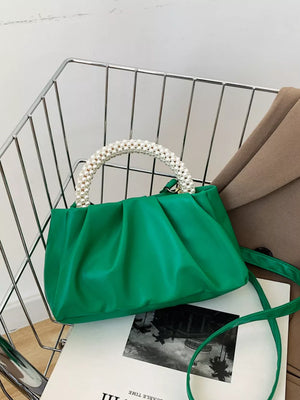 Green ruched crossbody bag with pearl handle and strap
