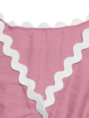 Pink maternity romper cover-up with white scalloped trim detail