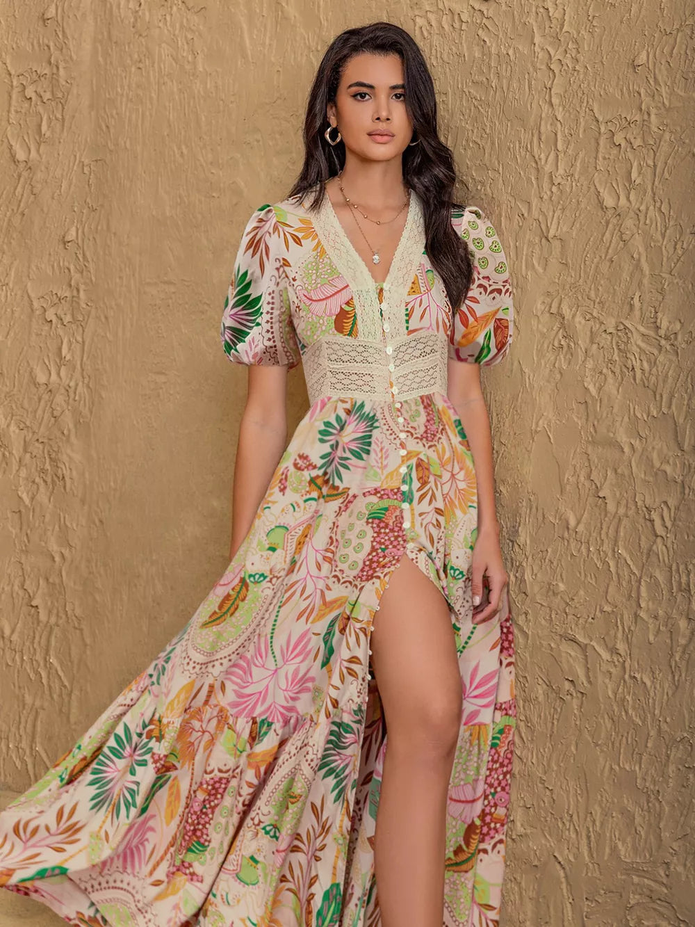 Tropical floral print maxi dress with lace trim, button front, puff sleeves, and high slit.