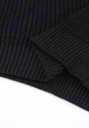Black knit v-neck pullover sweater with ribbed texture and cuff detail.