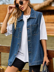 Sleeveless denim utility vest in dark gray with button front and chest pockets.