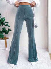Teal corduroy bell bottom trousers with vertical ribbing and a flared leg.