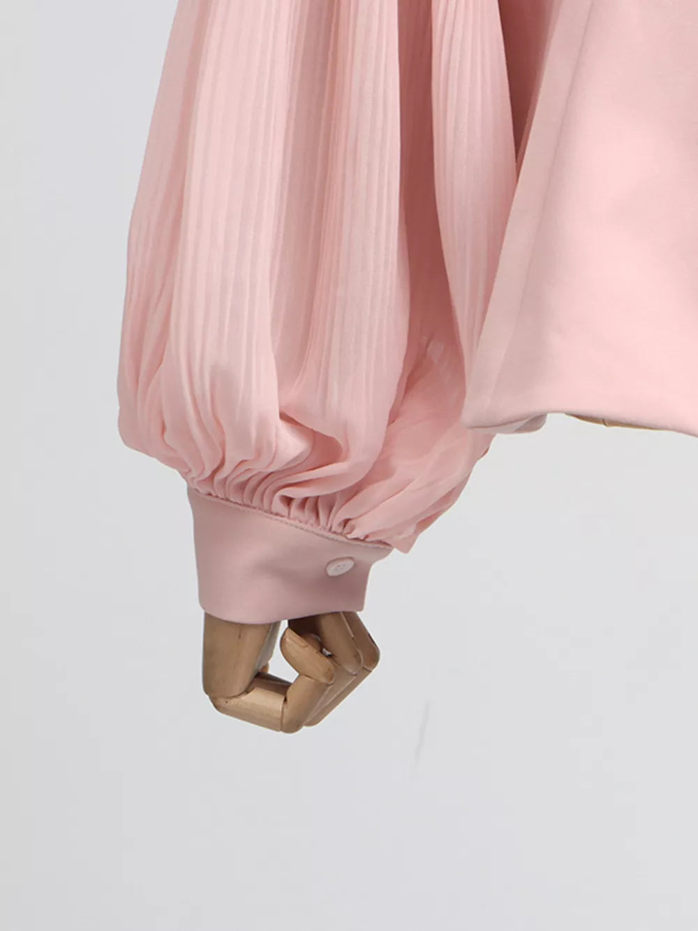 Pink skirt suit with pleated balloon sleeves and button cuff