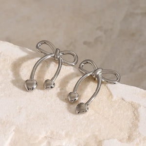 Silver bow drop earrings with heart charms