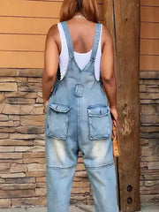 Light blue denim overalls with adjustable straps and button front, featuring cargo pockets.