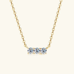 Gold bar necklace with three round moissanite stones, 18K gold-plated.