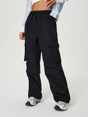 Black utility cargo pants with wide legs and multiple pockets.