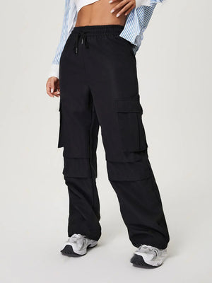 Black utility cargo pants with wide legs and multiple pockets.
