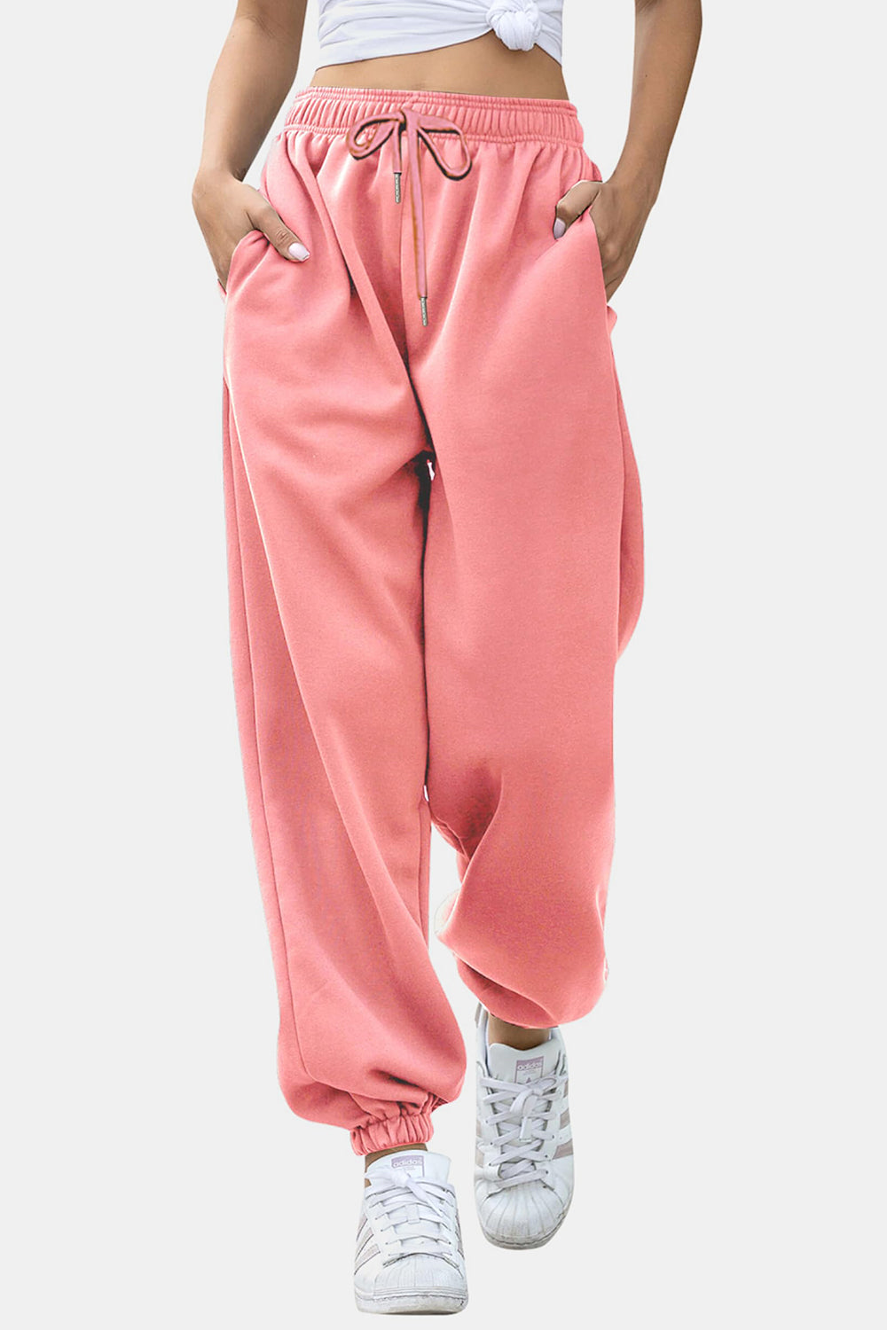 Dusty pink sweatpants with gathered cuffs and drawstring waist.