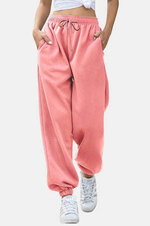 Dusty pink sweatpants with gathered cuffs and drawstring waist.
