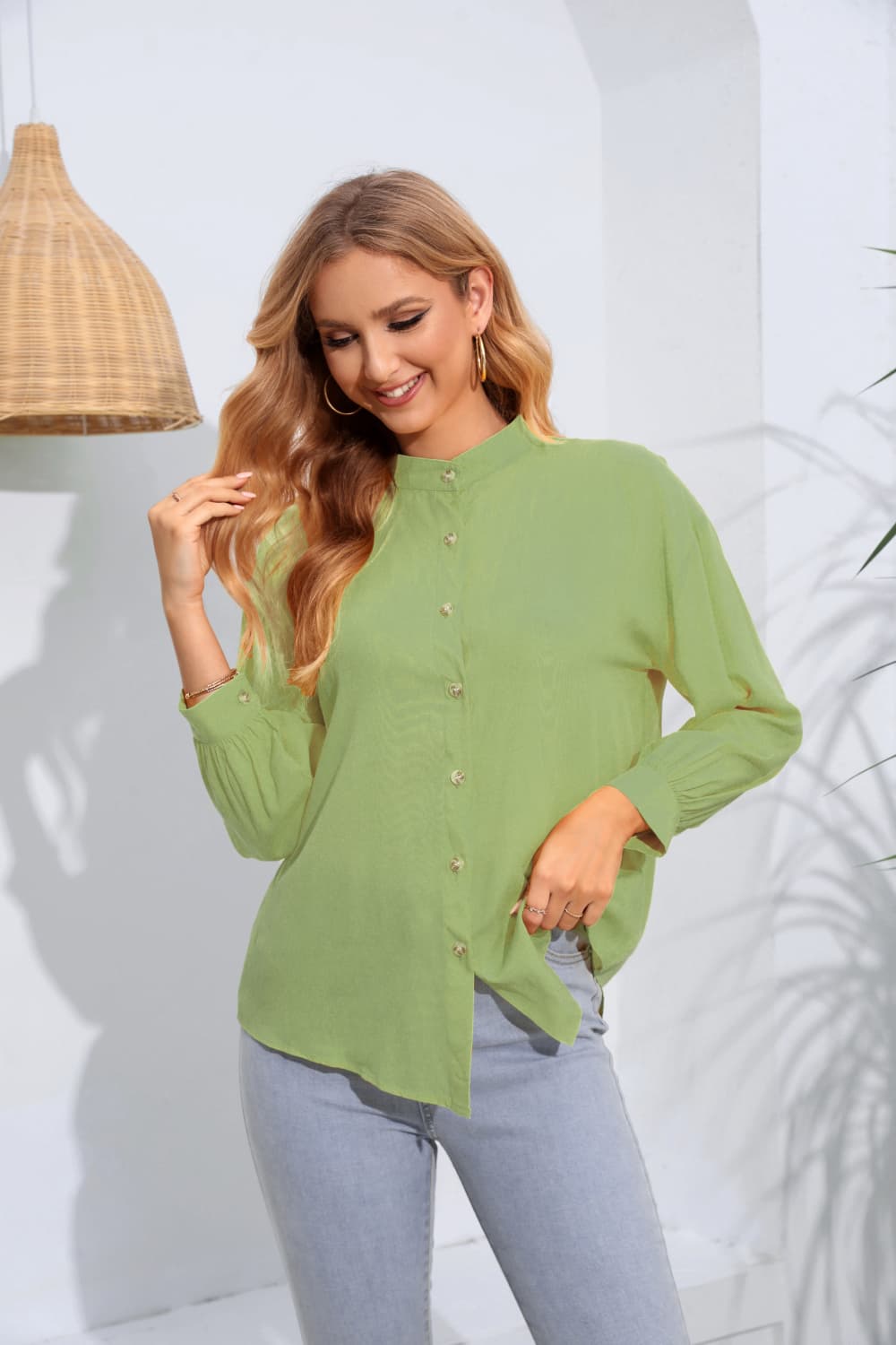 Light green mandarin collar blouse with button front and gathered sleeves.
