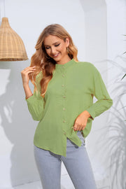 Light green mandarin collar blouse with button front and gathered sleeves.