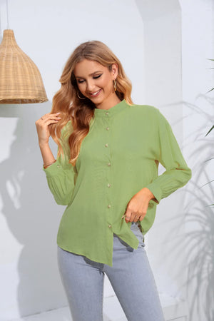 Light green mandarin collar blouse with button front and gathered sleeves.