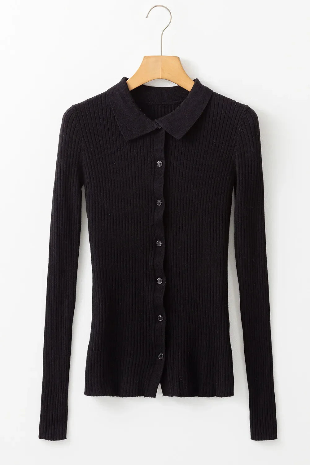 Black ribbed knit polo cardigan with button front and collar.