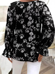 Black embroidered sheer long-sleeve blouse with ruffled cuffs.