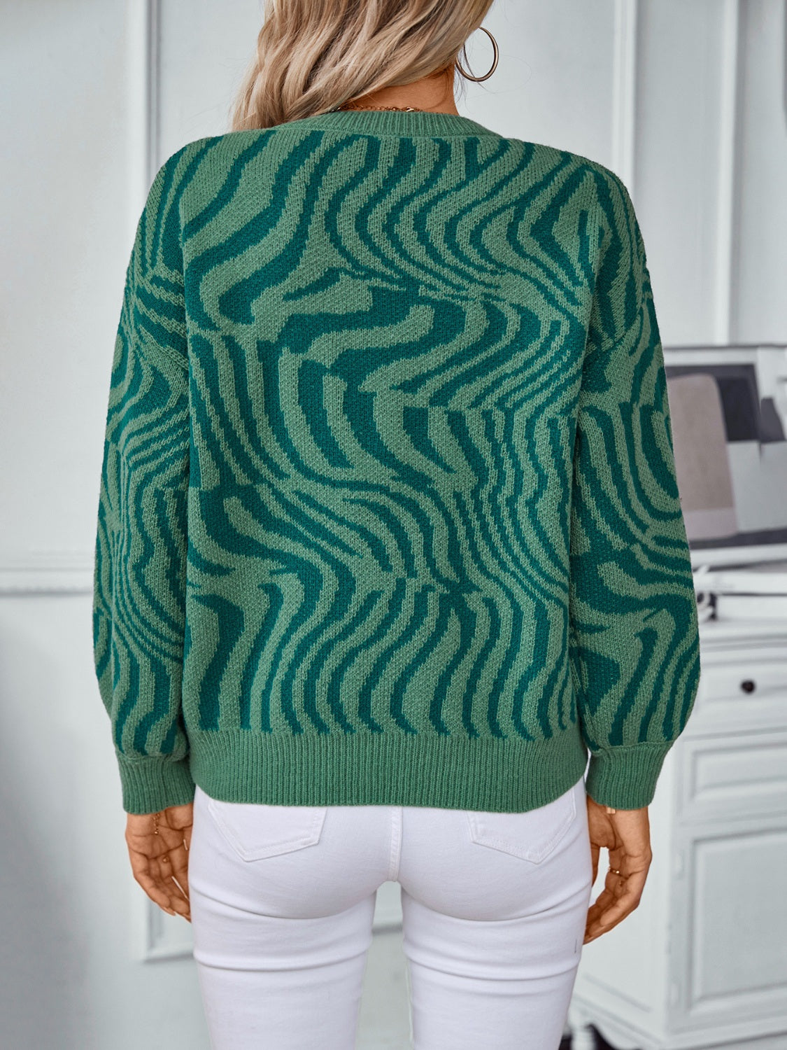 Dark green wavy knit crewneck sweater with a relaxed fit, acrylic material.