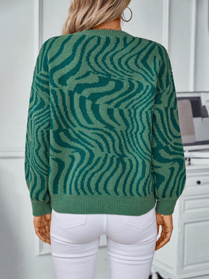 Dark green wavy knit crewneck sweater with a relaxed fit, acrylic material.
