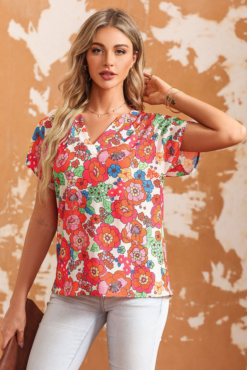 Multicolor floral print V-neck cap sleeve blouse with a casual fit.