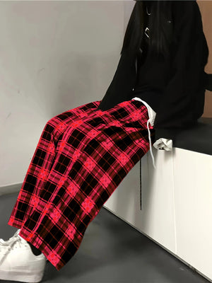 High waist wide leg pants in red and black plaid cotton, styled casually.