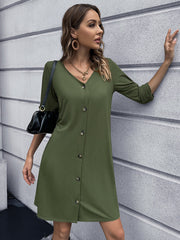 Olive green button-down mini dress with V-neck and 3/4 sleeves.