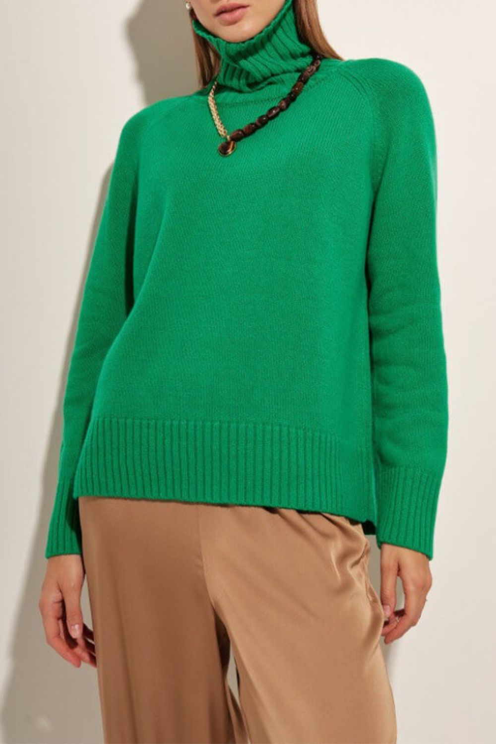 Mid Green cashmere turtleneck sweater with raglan sleeves and ribbed trim.