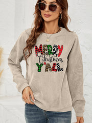 Beige corduroy sweatshirt with "Merry Christmas Y'all" graphic in plaid, leopard, and polka dot patterns.