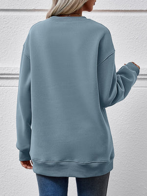 Misty Blue crewneck sweatshirt with ribbed cuffs and hem.