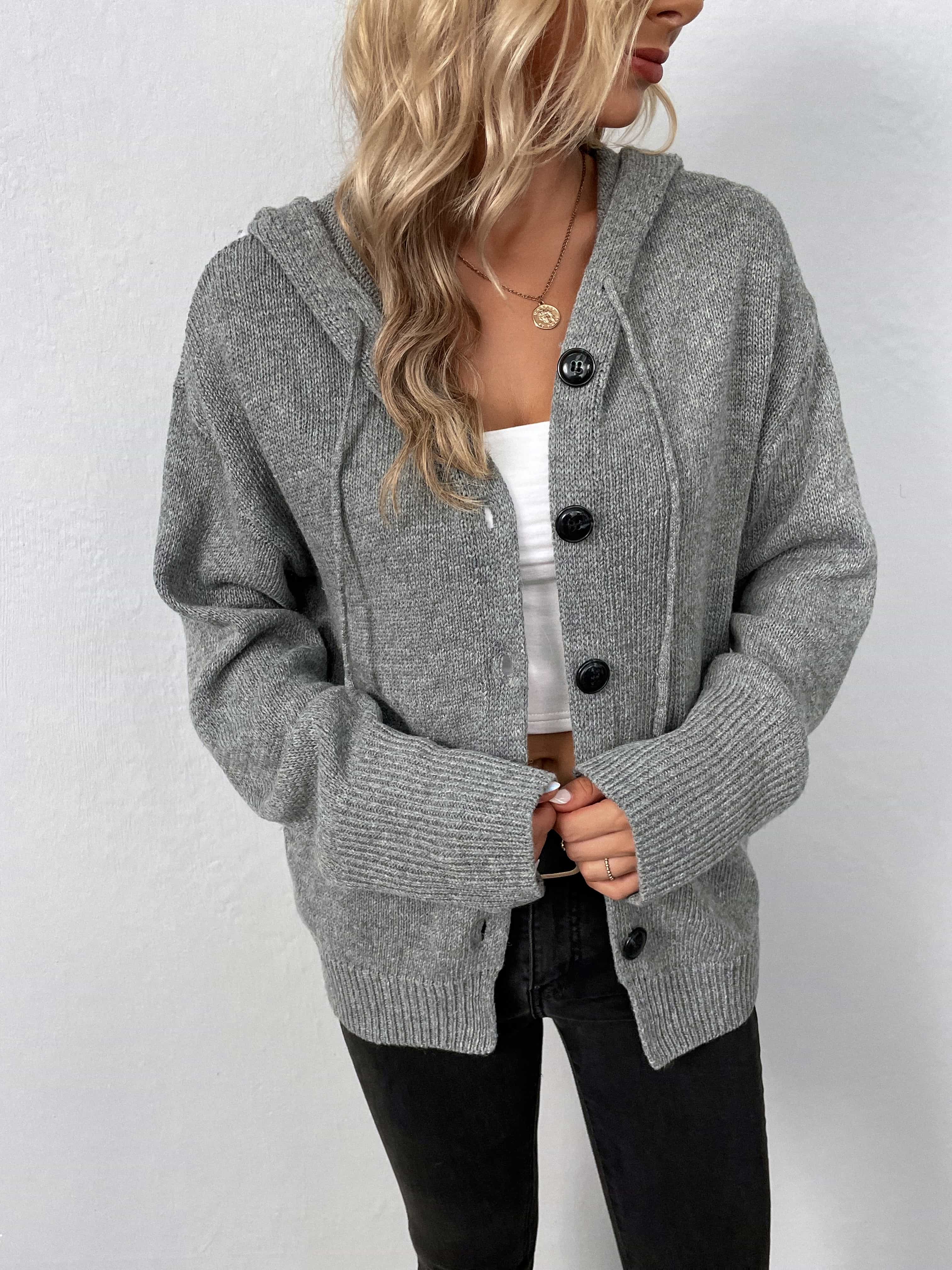Gray knit button-front hooded cardigan with drawstring and ribbed cuffs and hem.