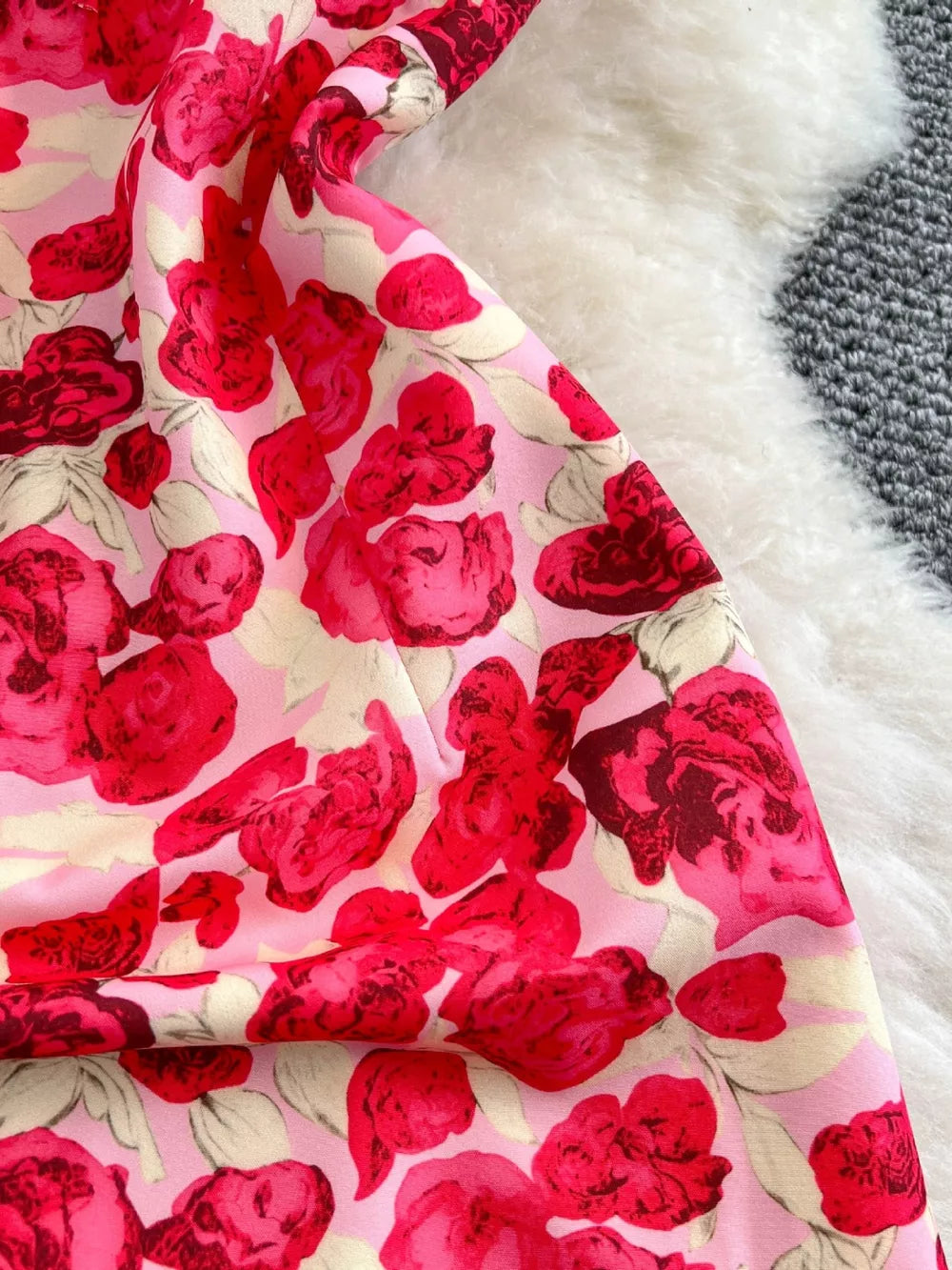 Charming Floral Ruffle Trim Mini Dress in pink with red roses, bow detail.