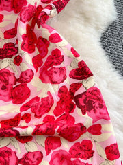 Charming Floral Ruffle Trim Mini Dress in pink with red roses, bow detail.