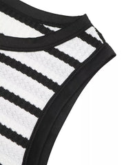 Sleek black and white striped bodycon midi dress with a textured knit and black trim detail.