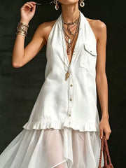 White halter maxi gown with button front, ruffled hem, and sheer skirt.