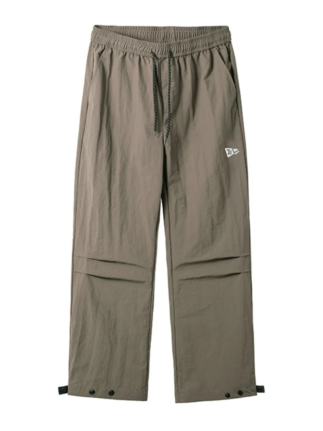 Mocha utility joggers with drawstring waist, cargo pockets, and adjustable ankle snaps.
