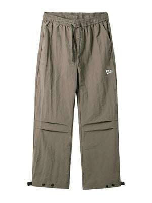 Mocha utility joggers with drawstring waist, cargo pockets, and adjustable ankle snaps.