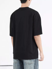 Black cotton t-shirt with round neck and short sleeves, shown from the back.