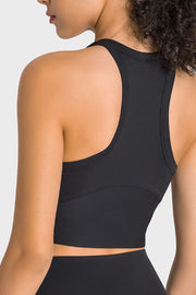 Black sculpted neckline crop top with racerback detail and supportive band.