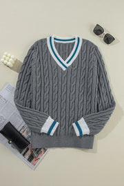 Dark gray cable knit sweater with V-neck and varsity trim on collar and cuffs.