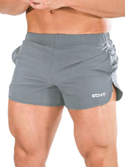 Gray athletic shorts with quick-dry fabric and a sculpted fit.