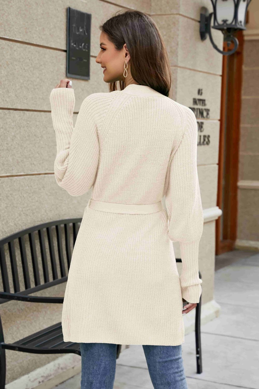 Cream knit cardigan with puffed sleeves and a matching belt, casual long sleeve sweater