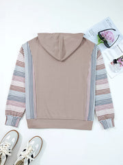 Relaxed fit cotton hoodie with multi-tonal striped sleeves and houndstooth detail.