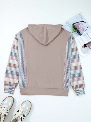 Relaxed fit cotton hoodie with multi-tonal striped sleeves and houndstooth detail.