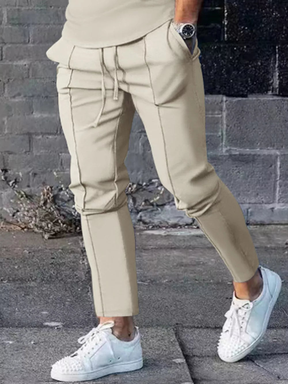 Casual drawstring sweatpants in apricot with pockets and stitched seams.
